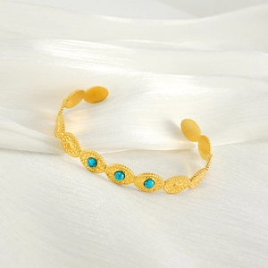 Retro 18K gold plated titanium steel cuff bracelet featuring blue natural stones on silk