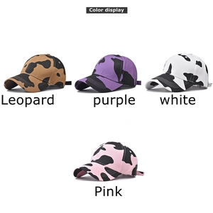 Cotton baseball cap with cow print pattern in four distinct colorways on white background