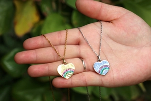 Rainbow heart pendant necklace in gold and silver finish with colorful gemstones