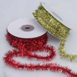 Red and gold metallic festive tinsel ribbons for Christmas and holiday gift decorations