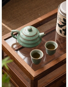 Detail of Ru Kiln celadon teacup set with crackle glaze and calligraphy tea canister