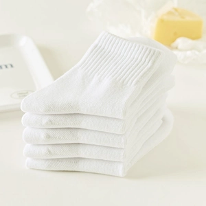 Pack of 5 pairs white mid-calf cotton socks for kids with soft knitted texture