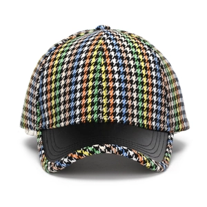 Colorful houndstooth baseball cap with black faux leather brim and adjustable back strap