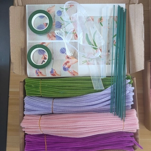 DIY floral kit with pipe cleaners, tape, stems, and English instruction manual
