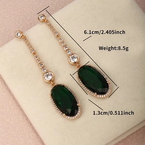 Detailed view of emerald drop earrings with size markers showing 6.1cm length and 8.5g weight