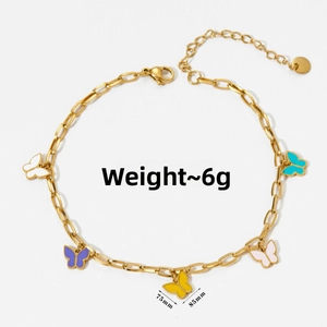 Detail of gold ankle chain with colorful enamel butterfly charms and length markings