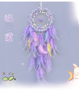 Close-up of DIY Dream Catcher in Creamy Purple with feathers and soft beads