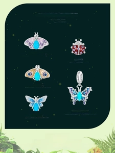 Detailed view of S925 sterling silver luminous butterfly charms and glowing insect beads