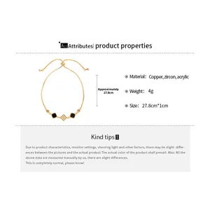 Detailed view of adjustable gold-plated bracelet with square zircon and black pendants