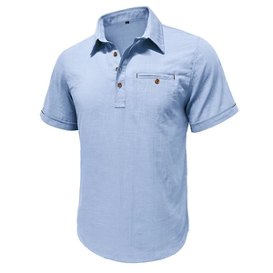Detail of light blue linen-blend shirt with four-button henley collar and chest pocket