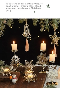 Detail of gold metal Christmas candle holders with snowflake and deer shapes in warm light