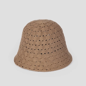Close-up of the breathable knitted hollow wave pattern on the brown bucket hat