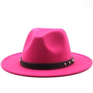 Close-up of pink wool fedora hat featuring a black leather belt and silver metal studs