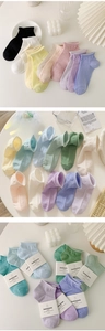Detail view of breathable cotton mesh socks in pastel macaron colors with ribbed cuffs