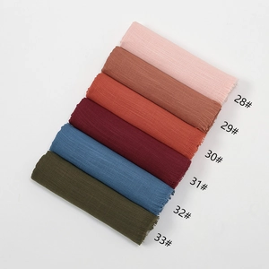 Close-up showing various colors of breathable slub cotton scarves from 28# to 33#