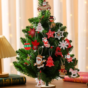 Wooden Christmas tree ornaments set with various festive shapes in warm indoor setting