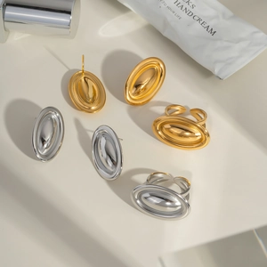 Minimalist gold and silver oval earring and adjustable ring set in polished steel