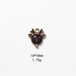 Detail of Christmas reindeer pendant with black enamel, red nose and crystal accent