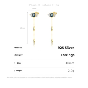 Detail showing 925 silver long drop earrings with blue stones and white zircon wings