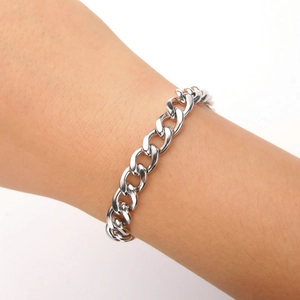Classic silver stainless steel Cuban link bracelet for men and women on a wrist
