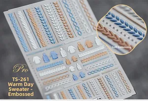 Detail of 5D embossed nail stickers featuring winter sweater texture and cable knit patterns