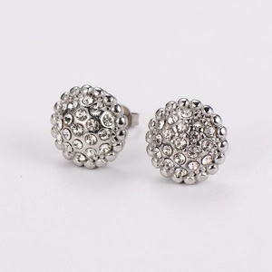 Macro shot of silver round stud earrings featuring shimmering pavé set clear crystals