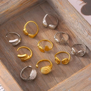 10-piece set of textured gold and silver stackable rings in a vintage wooden box