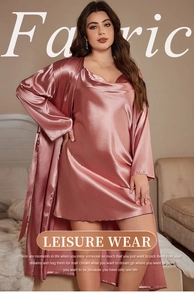 Detail of pink satin sleepwear set featuring a V-neck chemise and matching long-sleeved robe