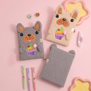 Detail of plush A5 puppy diary with secure metal lock and embroidered cupcake design