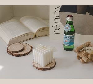 Bubble cube scented candle on natural wood base with elegant ribbon detail