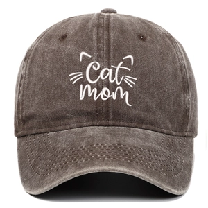 Close-up of Cat Mom white embroidery on vintage washed cotton baseball cap texture
