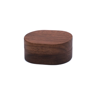 Portable oval walnut wood jewelry box for rings and earrings with natural grain