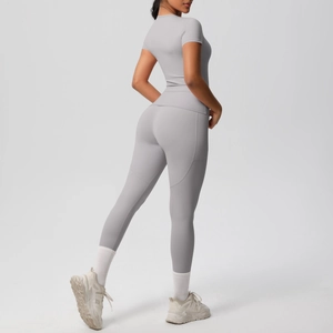 Detailed back view of light gray high-waisted yoga set with seamless short sleeve top