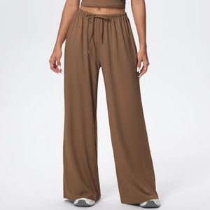 Women's dark brown wide leg athletic pants with high waist drawstring and draped silhouette