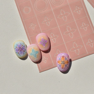 Détail des stickers pour ongles bohèmes à fleurs avec des dégradés de couleurs vifs