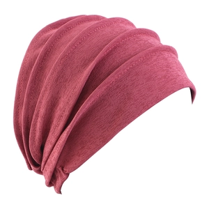 Detail of rose red pleated turban cap for women with high-quality knit fabric texture