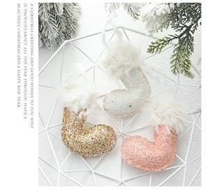 Glittery Christmas stocking ornaments with faux fur trim in a stylish decorative basket