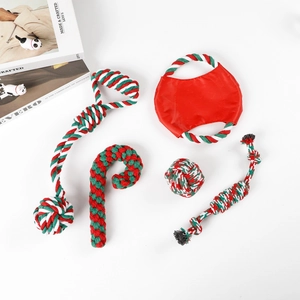 Detailed overhead view of 5-piece Christmas dog chew toy set in red, green and white cotton