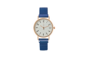 Detail view of stylish blue mesh magnetic strap and gold round quartz watch case