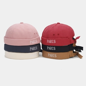 Detail view showing multi-color cotton miki hats with white PARIS embroidery on the brim