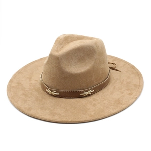 Detail of vintage khaki suede fedora hat with dark brown leather belt and decorative stitching