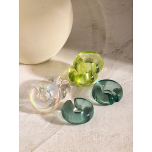 Chunky C-shaped resin ear clips in emerald green, deep cyan, and iridescent white