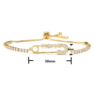 Detail view of gold adjustable MOM safety pin bracelet with zircon micro-pave 30x8mm