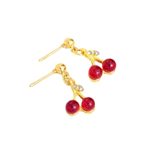 Sparkling red cherry drop earrings with gold stem and rhinestone leaves on white background