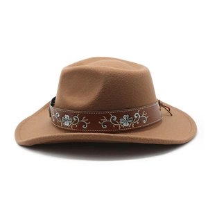 Detailed view of dark brown felt cowboy hat with floral embroidered band decoration