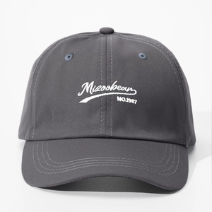 Dark grey cotton baseball cap featuring Mizookean NO.1987 white embroidery and curved brim