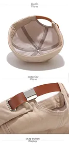 Detail of khaki docker cap featuring brown leather back strap and silver metal buckle