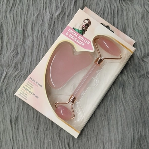 Pink quartz facial roller and gua sha set in a premium white gift box with display window