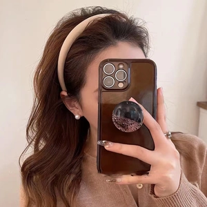 Coque iPhone translucide marron foncé avec support pailleté à sable mouvant