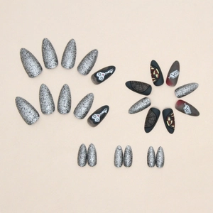 Dark gothic almond press-on nails with silver glitter and black spider web Halloween design